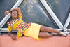 Colorful African print blouse and yellow skirt